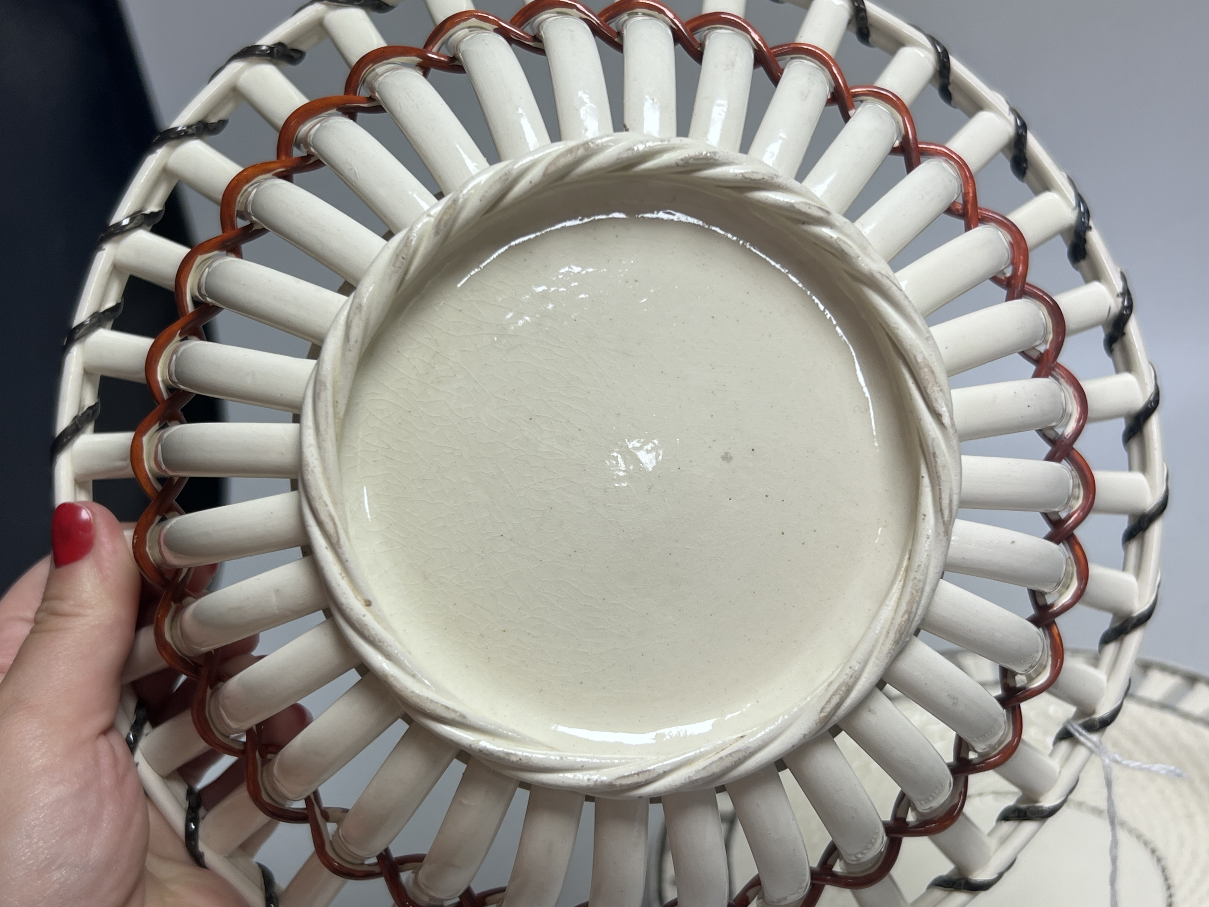 An early 19th century creamware chestnut basket and stand, 24cm
